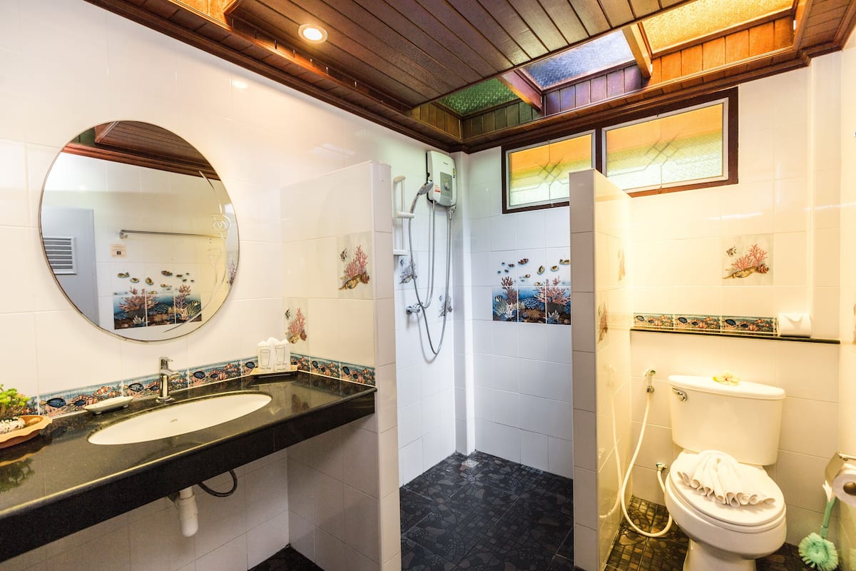 bungalow, beachfront | bathroom | combined shower/bathtub, free toiletries, hair dryer, bathrobes