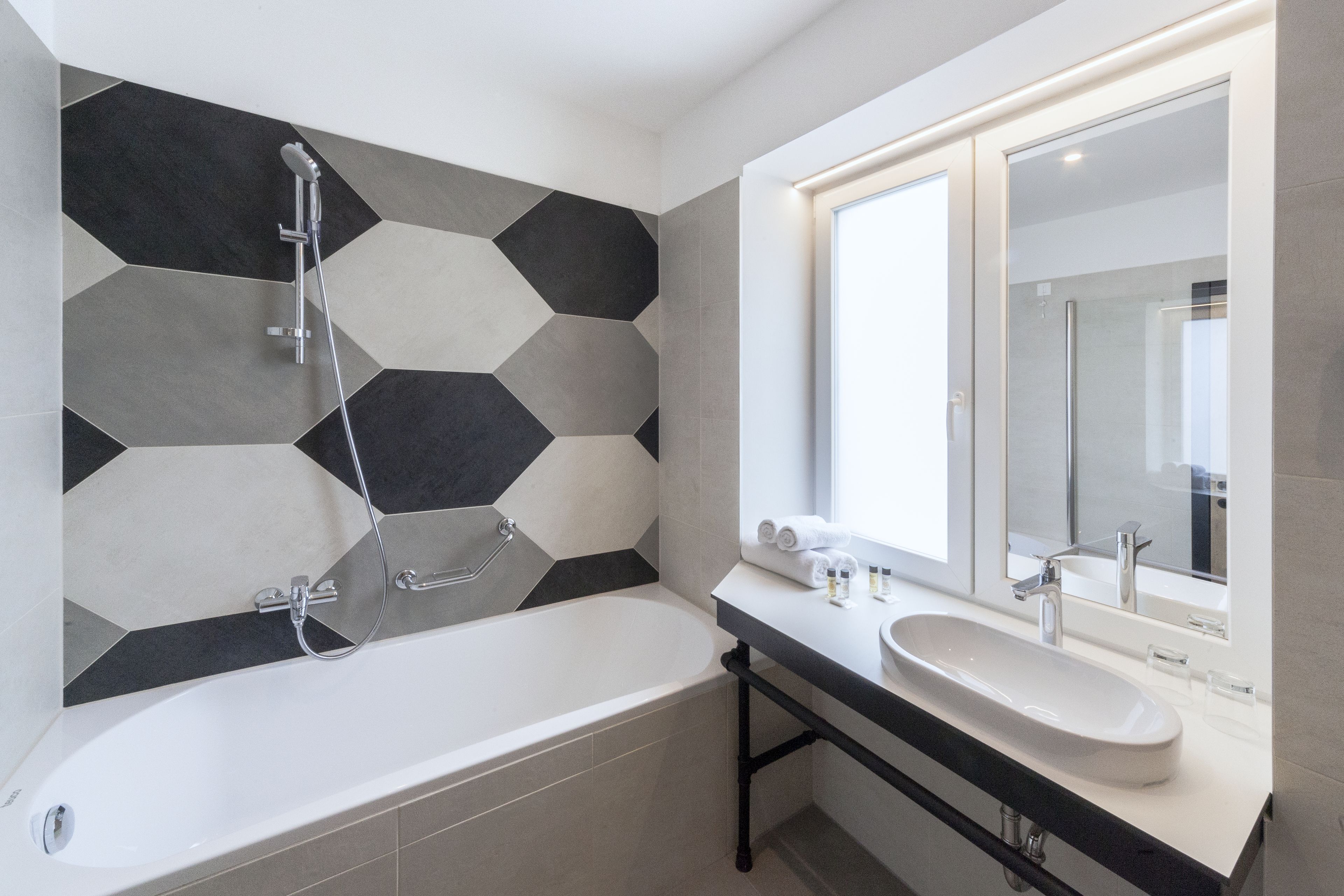 deluxe double room | bathroom | free toiletries, hair dryer, towels