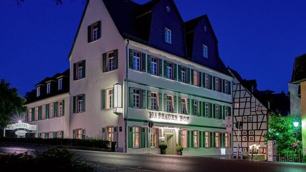 A traditional European hotel with a prominent sign, multiple windows, and a classic architectural style. - Nassauer Hof Limburg (Limburg an der Lahn)