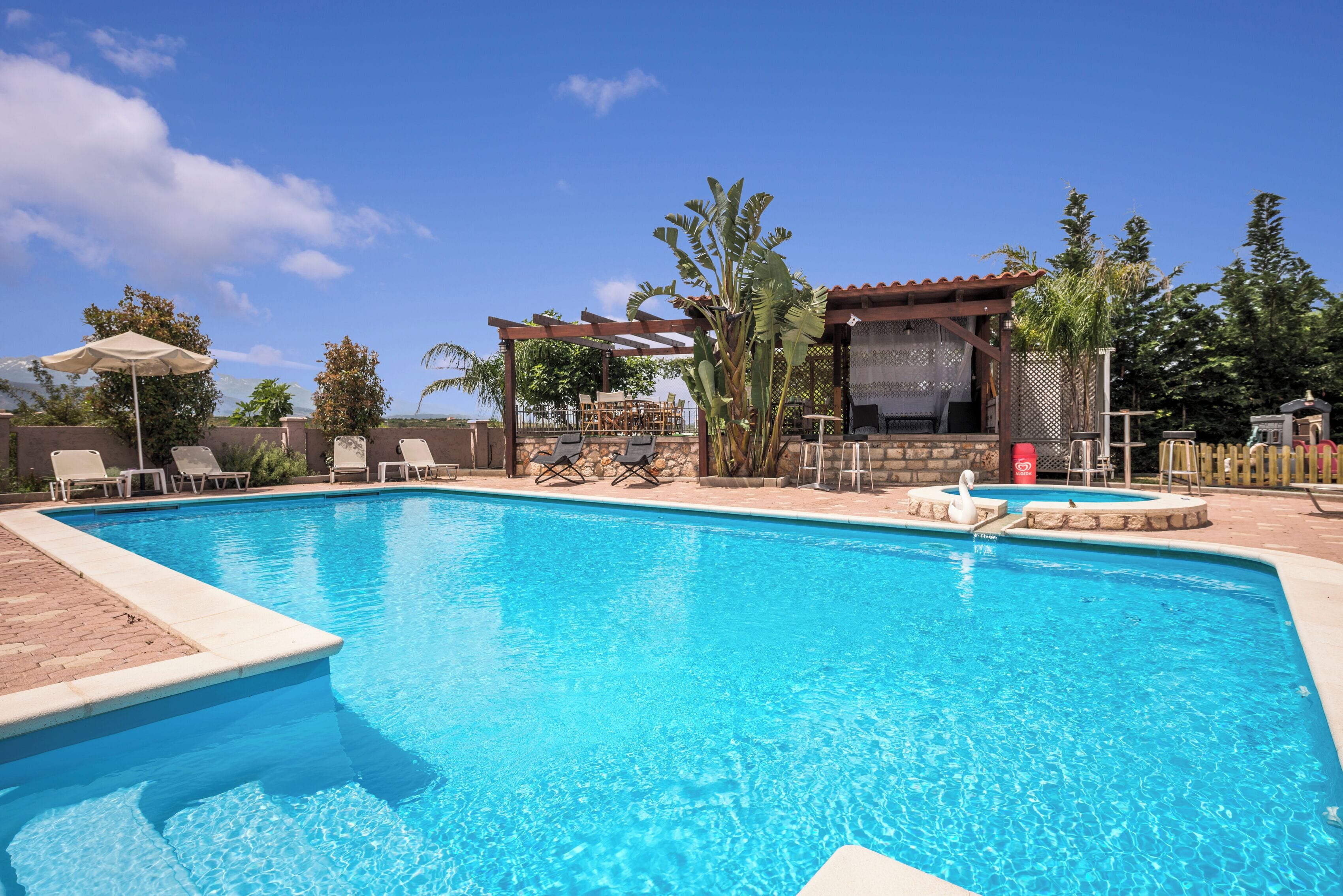 outdoor pool, pool umbrellas, pool loungers