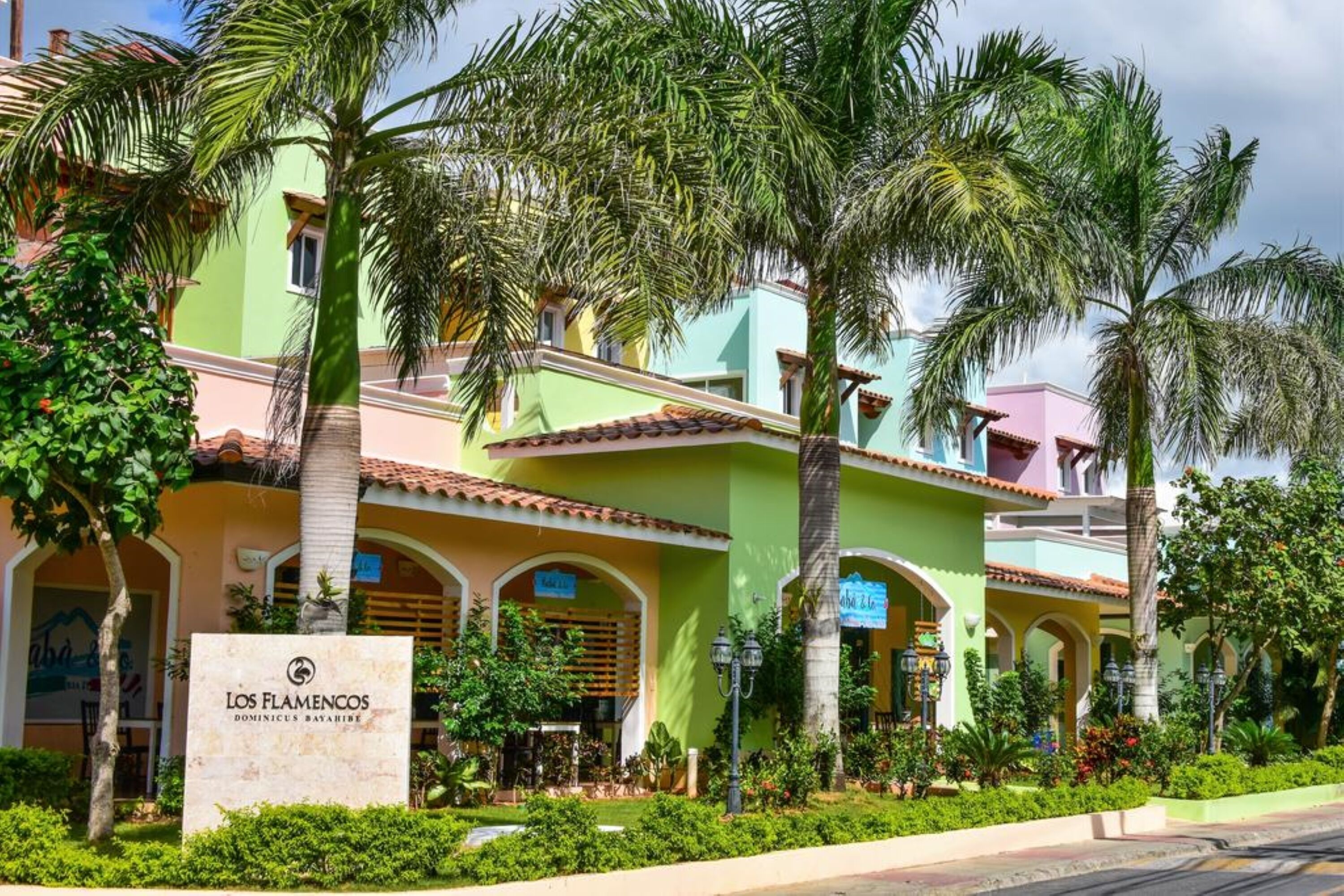 A hotel with a sign reading "Los Flamencos Dominicus Bayahibe".