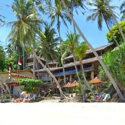 On the beach, white sand, sun loungers, beach umbrellas