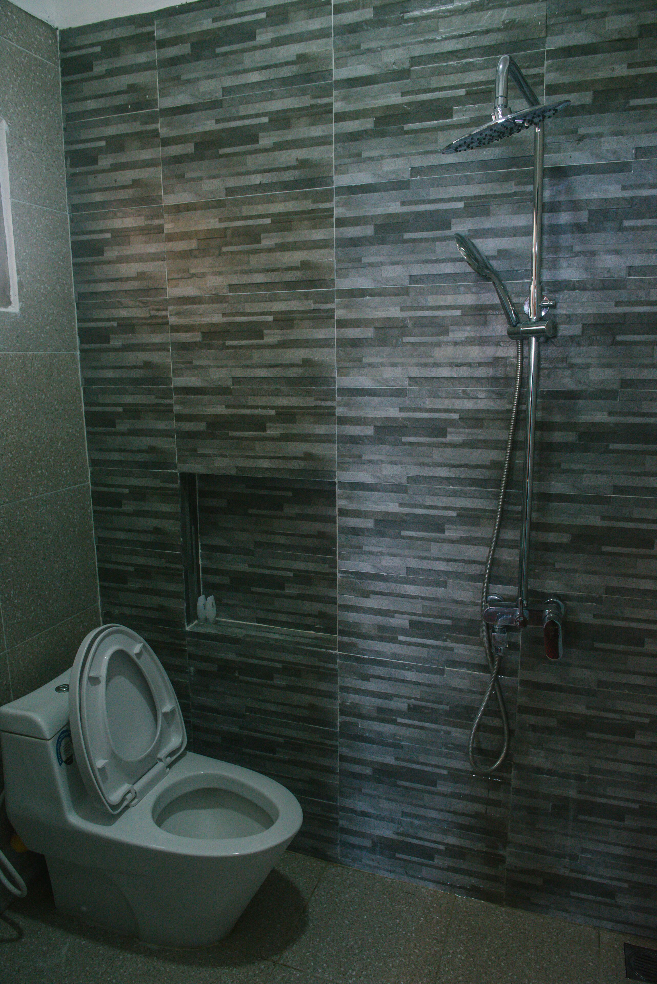 beachfront bungalow | bathroom | shower, rainfall showerhead, free toiletries, hair dryer