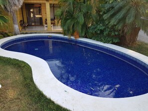 Outdoor pool, open 7:00 AM to 9:00 PM, pool loungers