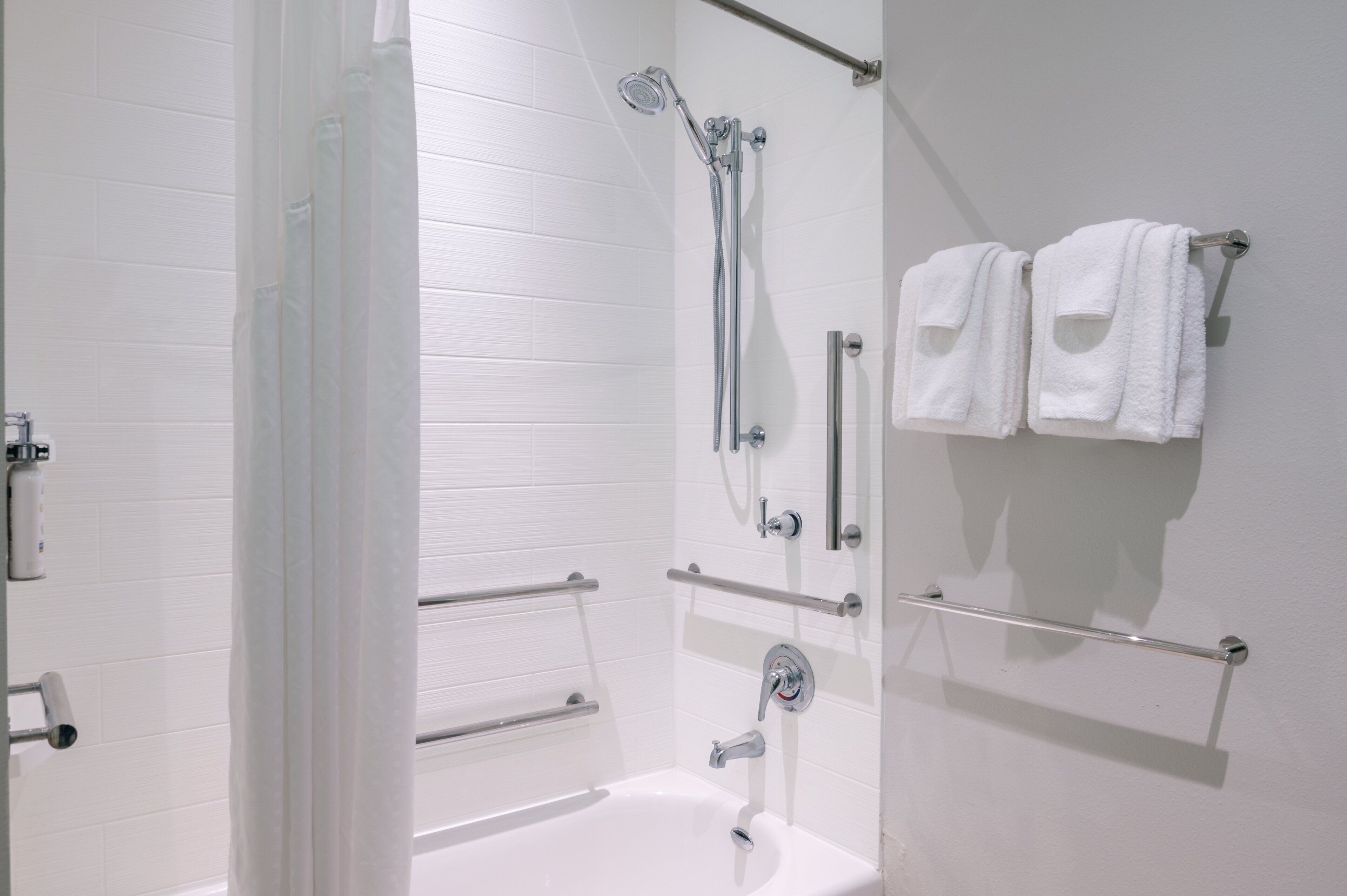 designer toiletries, hair dryer, towels, soap