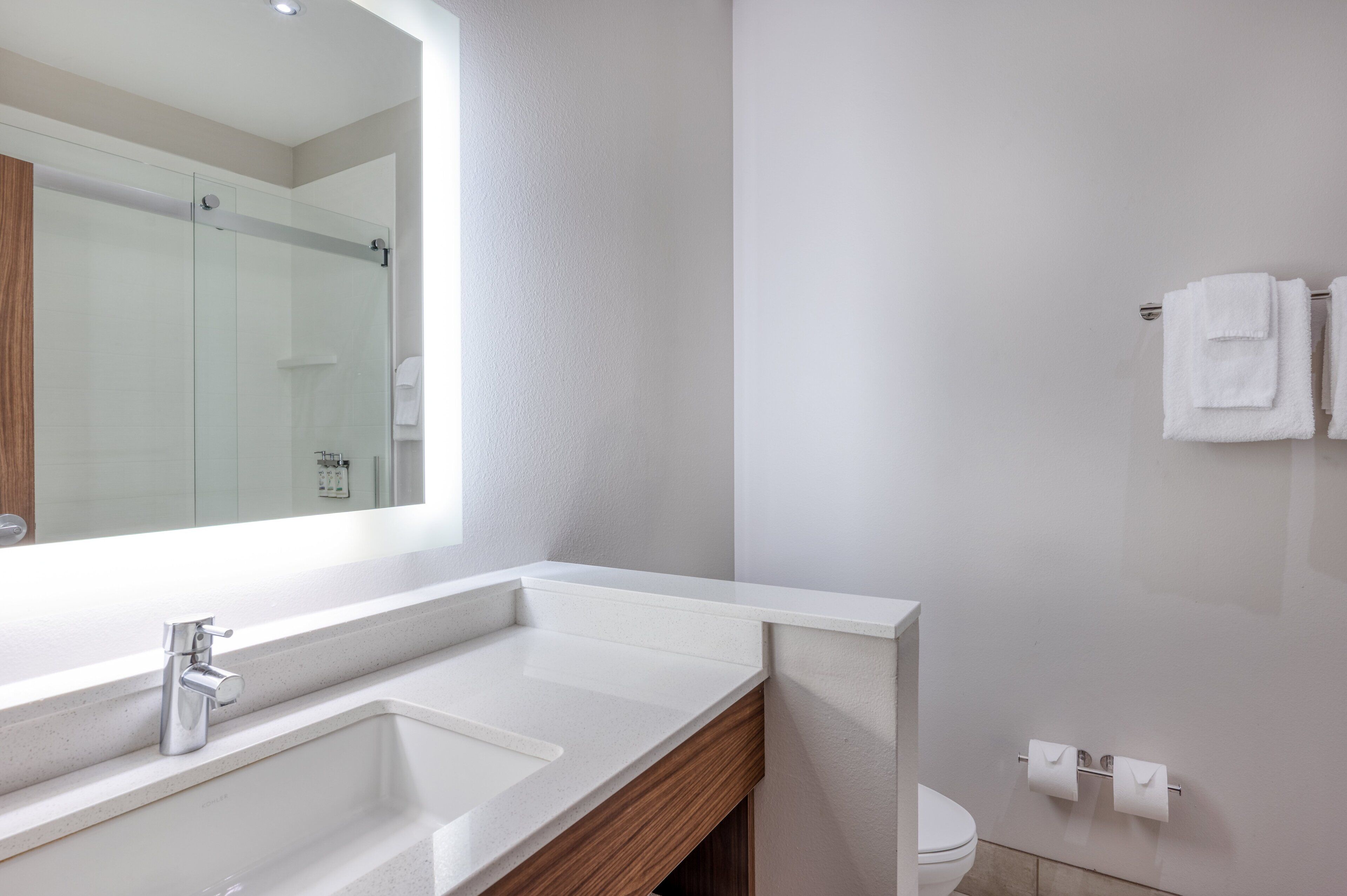 designer toiletries, hair dryer, towels, soap