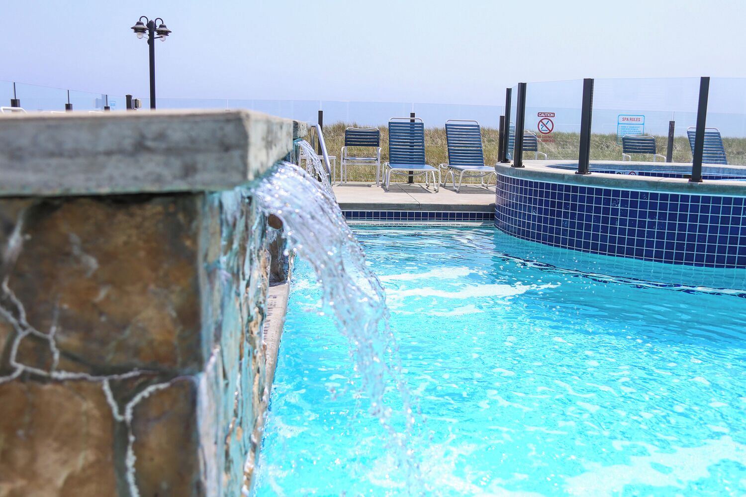 outdoor pool, open 9 am to 10 pm, pool loungers