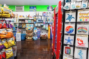A store with shelves stocked with snacks, toys, and various household items. - Waves Oceanfront Resort (Old Orchard Beach)