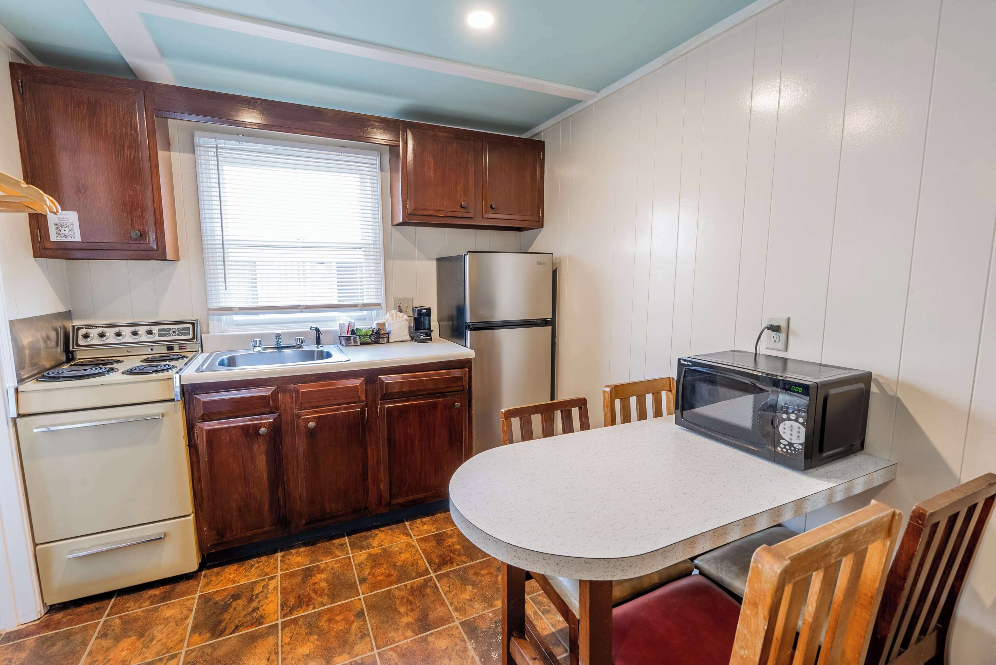 standard queen room | private kitchenette | fridge, stovetop, coffee/tea maker, cookware/dishes/utensils