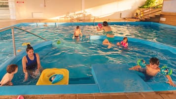 Indoor pool, pool umbrellas, sun loungers