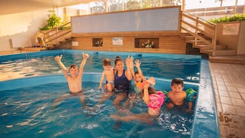 Indoor pool, pool umbrellas, pool loungers