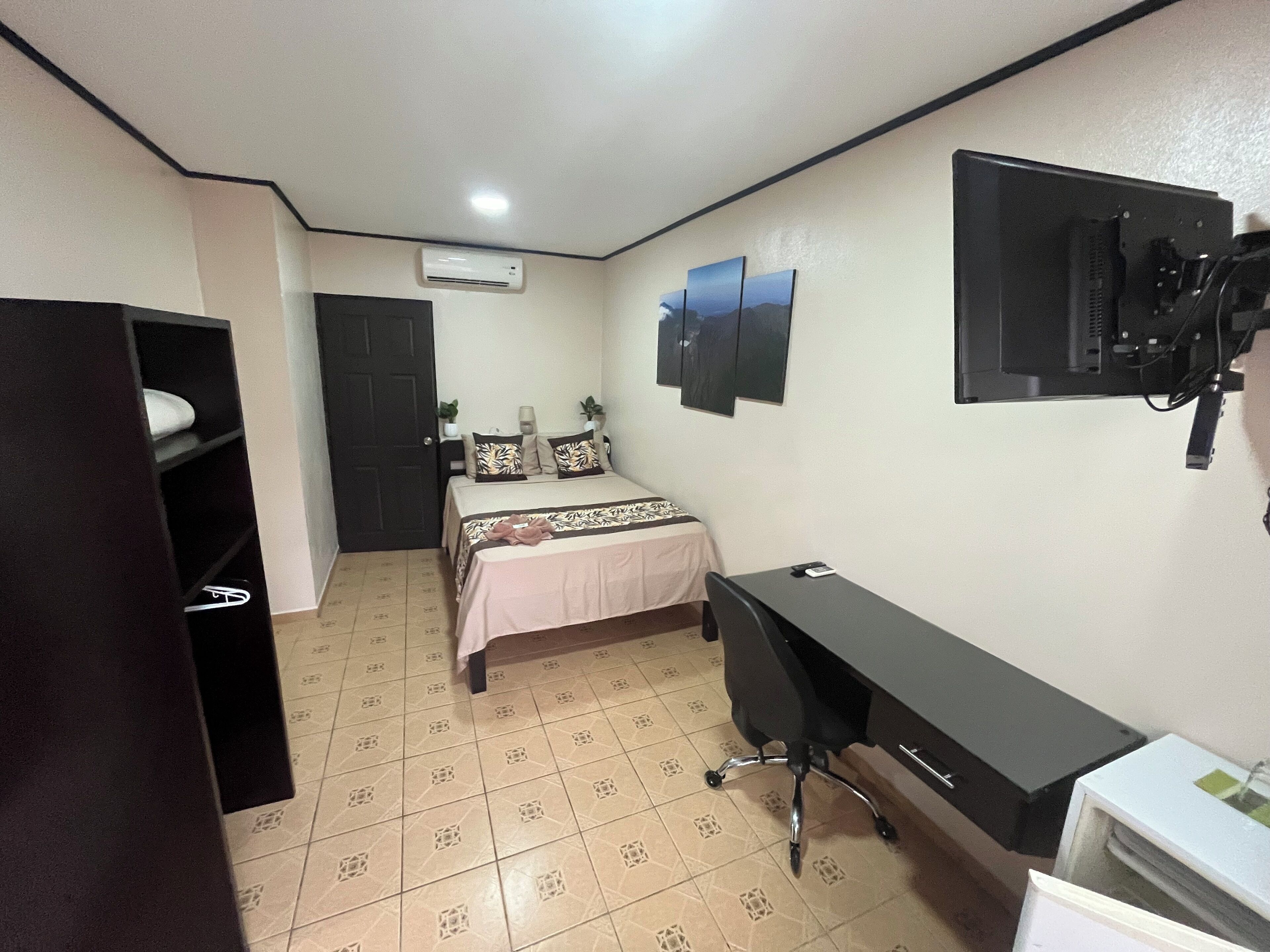 premium bedding, desk, laptop workspace, blackout curtains