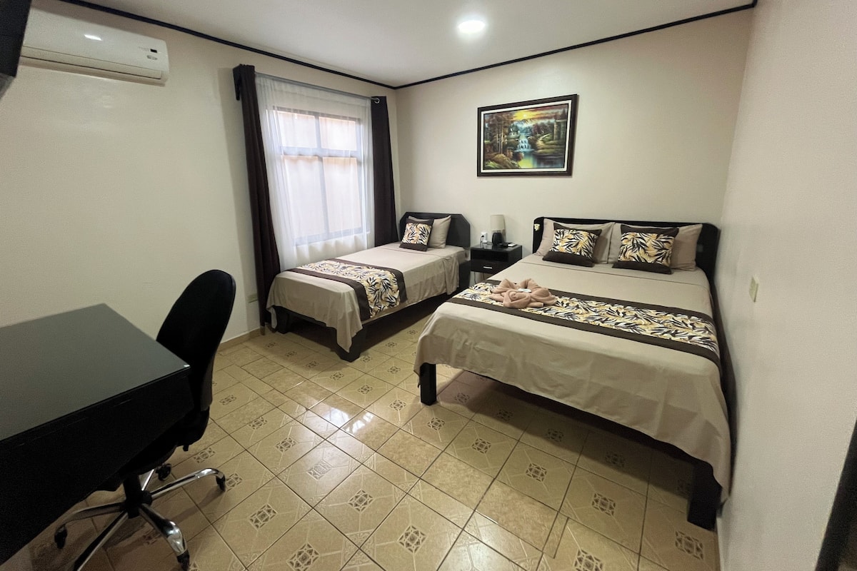 Premium bedding, desk, laptop workspace, blackout curtains