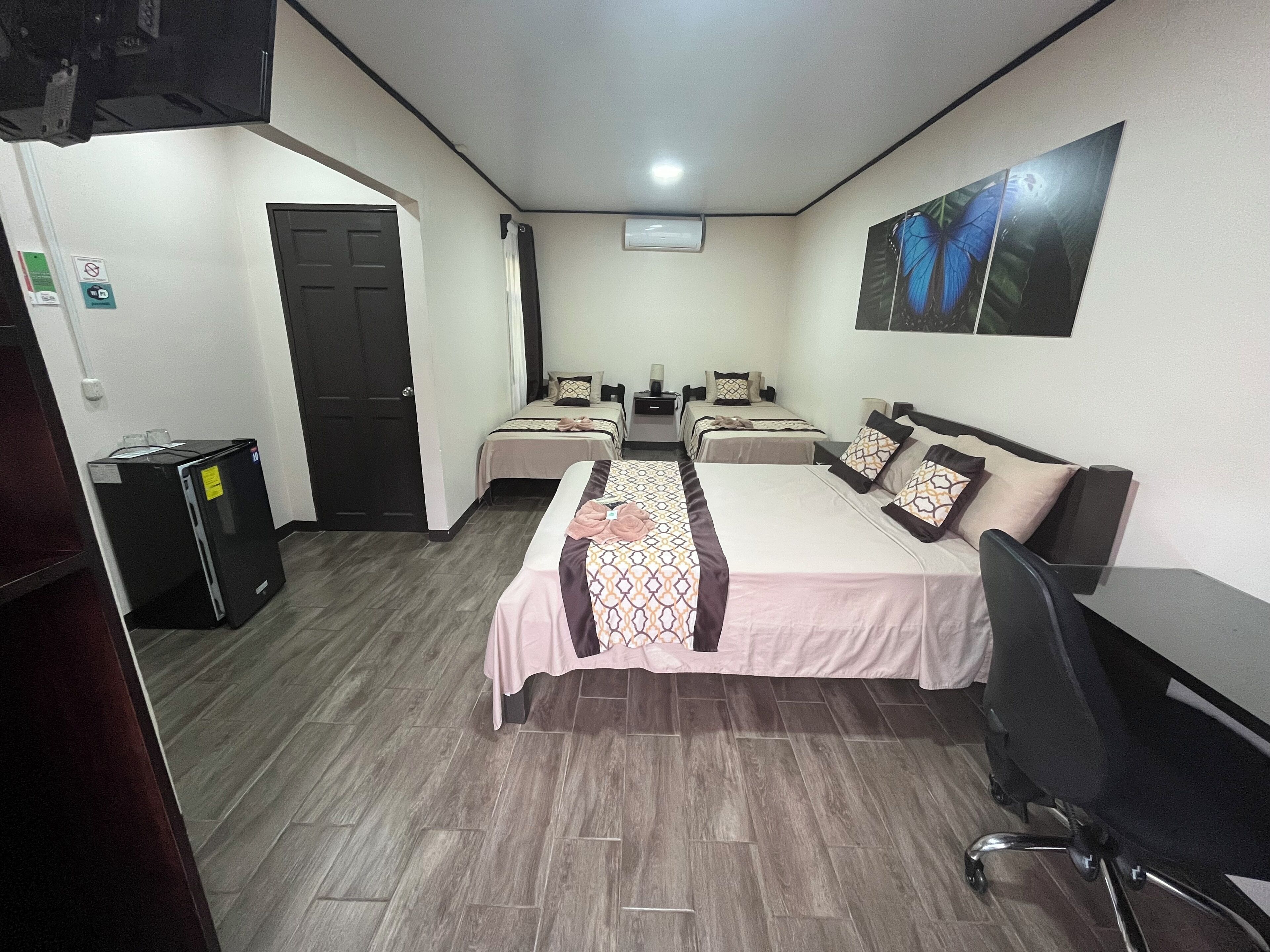 triple room | premium bedding, desk, laptop workspace, blackout curtains