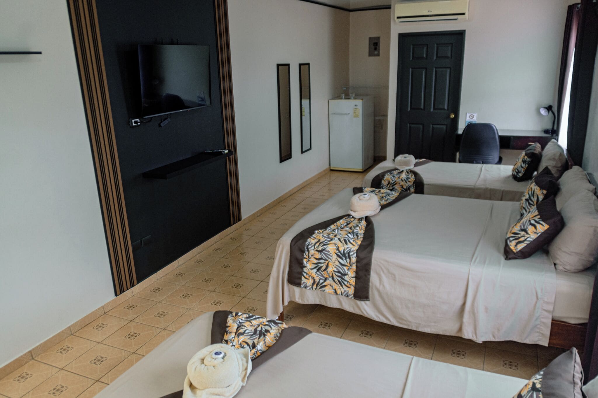 Premium bedding, desk, laptop workspace, blackout drapes