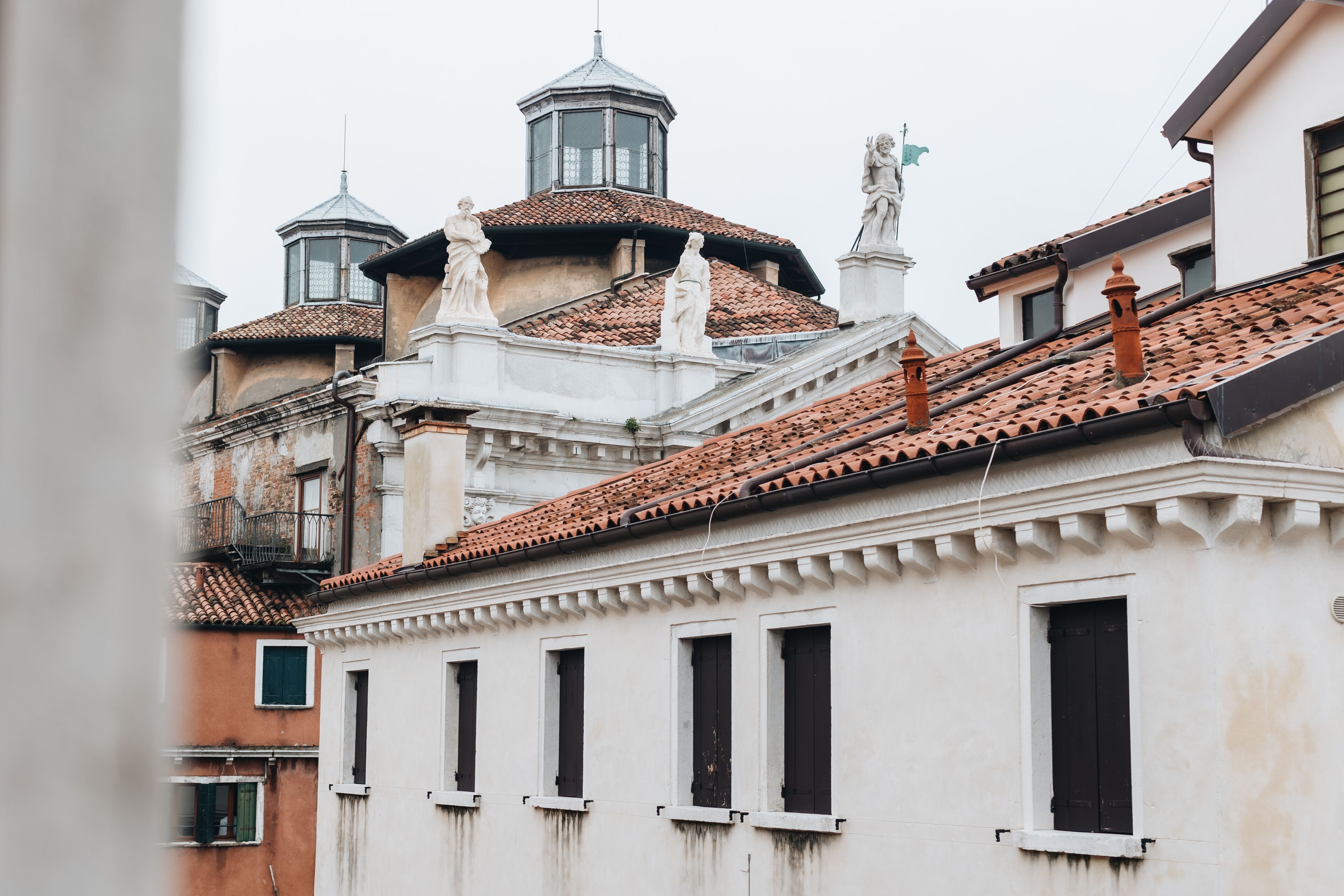 A building with multiple windows and a tiled roof.