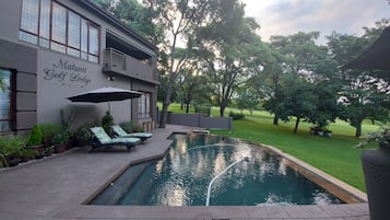 Outdoor pool, pool umbrellas, sun loungers