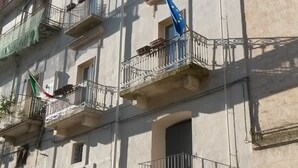A multi-story building with balconies, a visible entrance labeled "AL BASTION," and a flag. - Al Bastione Relais (Gravina in Puglia)