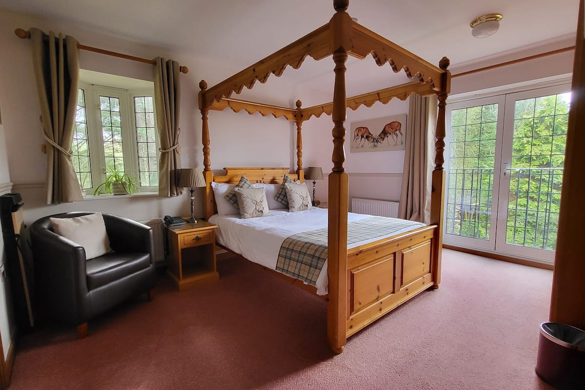 luxury room | in-room safe, desk, iron/ironing board, cots/infant beds