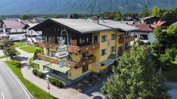 Guesthouse room with a traditional architectural style and wooden balconies.