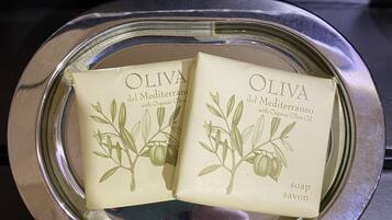 Two bars of olive soap on a metallic tray.
