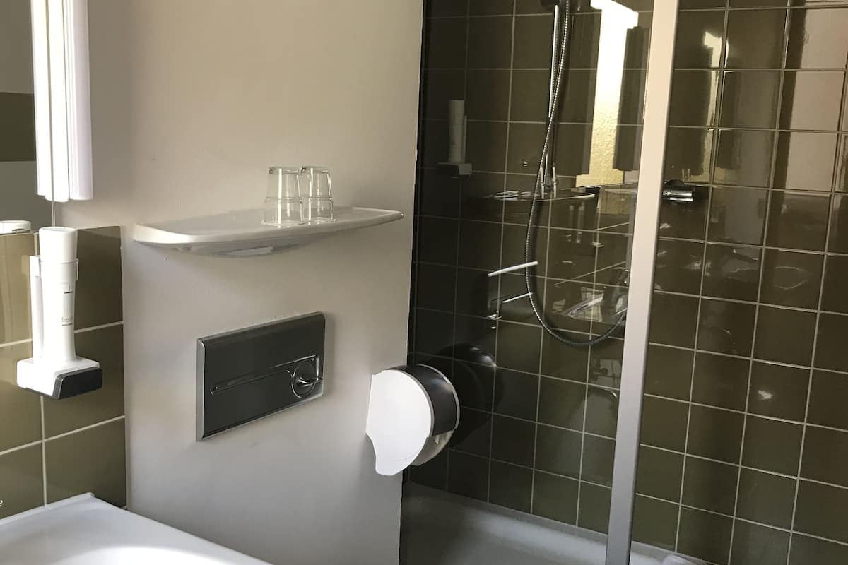 standard triple room | bathroom | hair dryer, towels