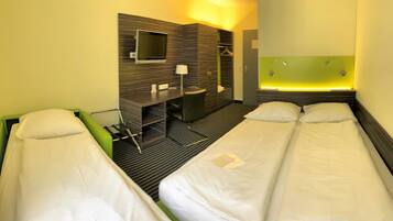 Standard Triple Room | Desk, blackout drapes, soundproofing, free WiFi