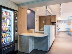Enjoy refreshments from the in-room vending machine and dine at the casual seating area with a kitchenette for self-catering.
