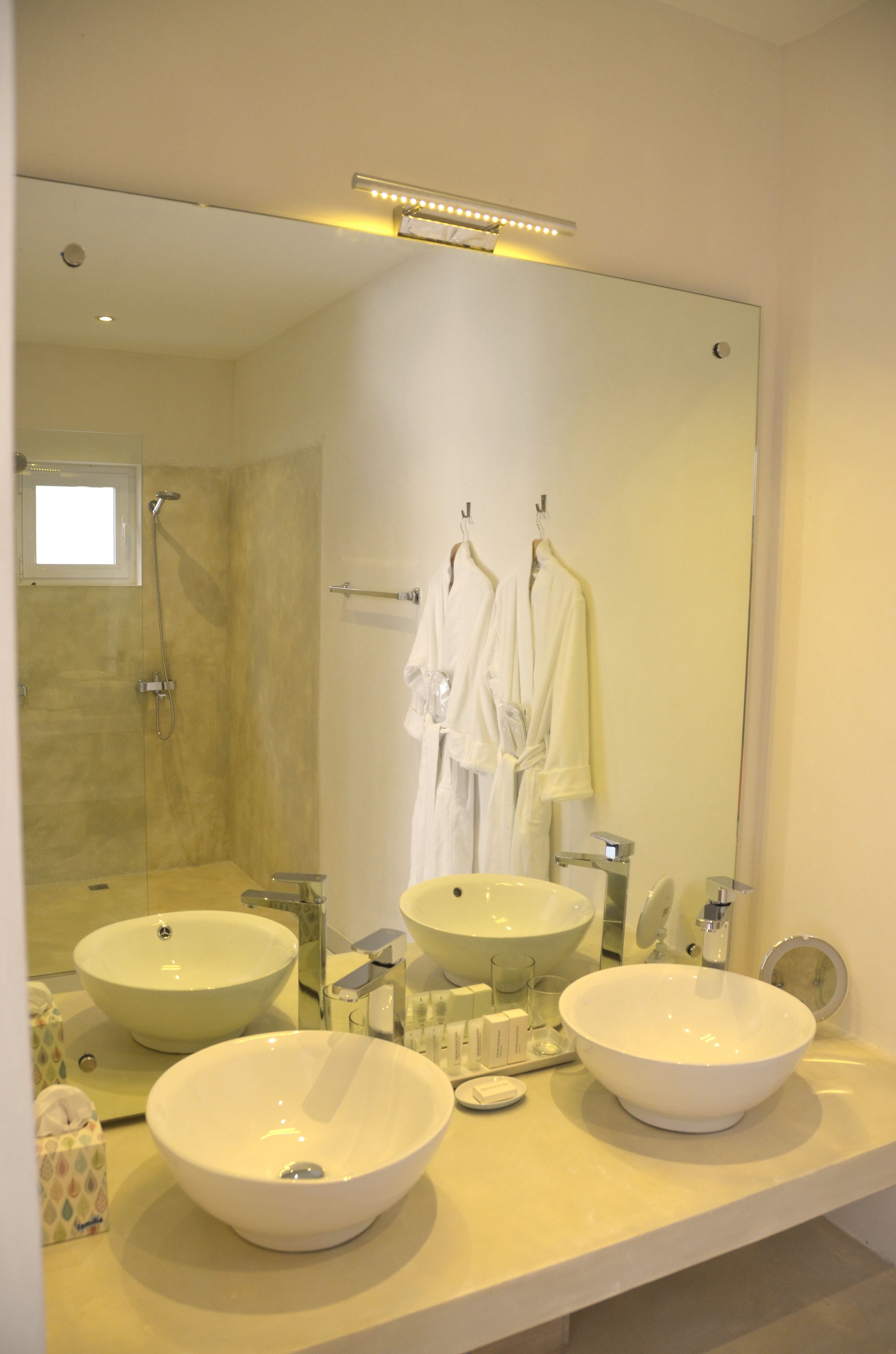 standard suite, 1 bedroom, ground floor | bathroom | rainfall showerhead, designer toiletries, hair dryer, bathrobes
