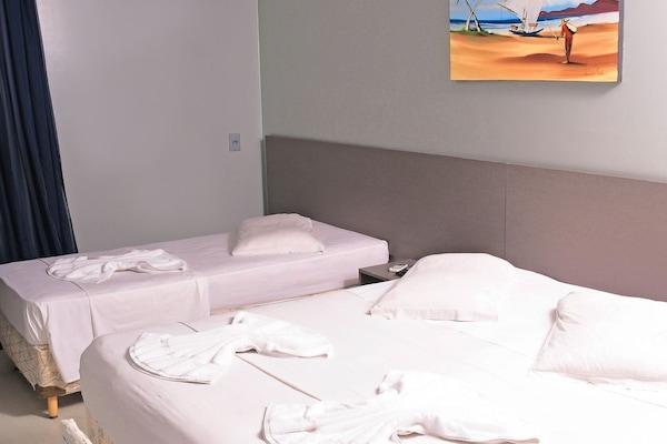 Family Room | Minibar, in-room safe, desk, blackout drapes