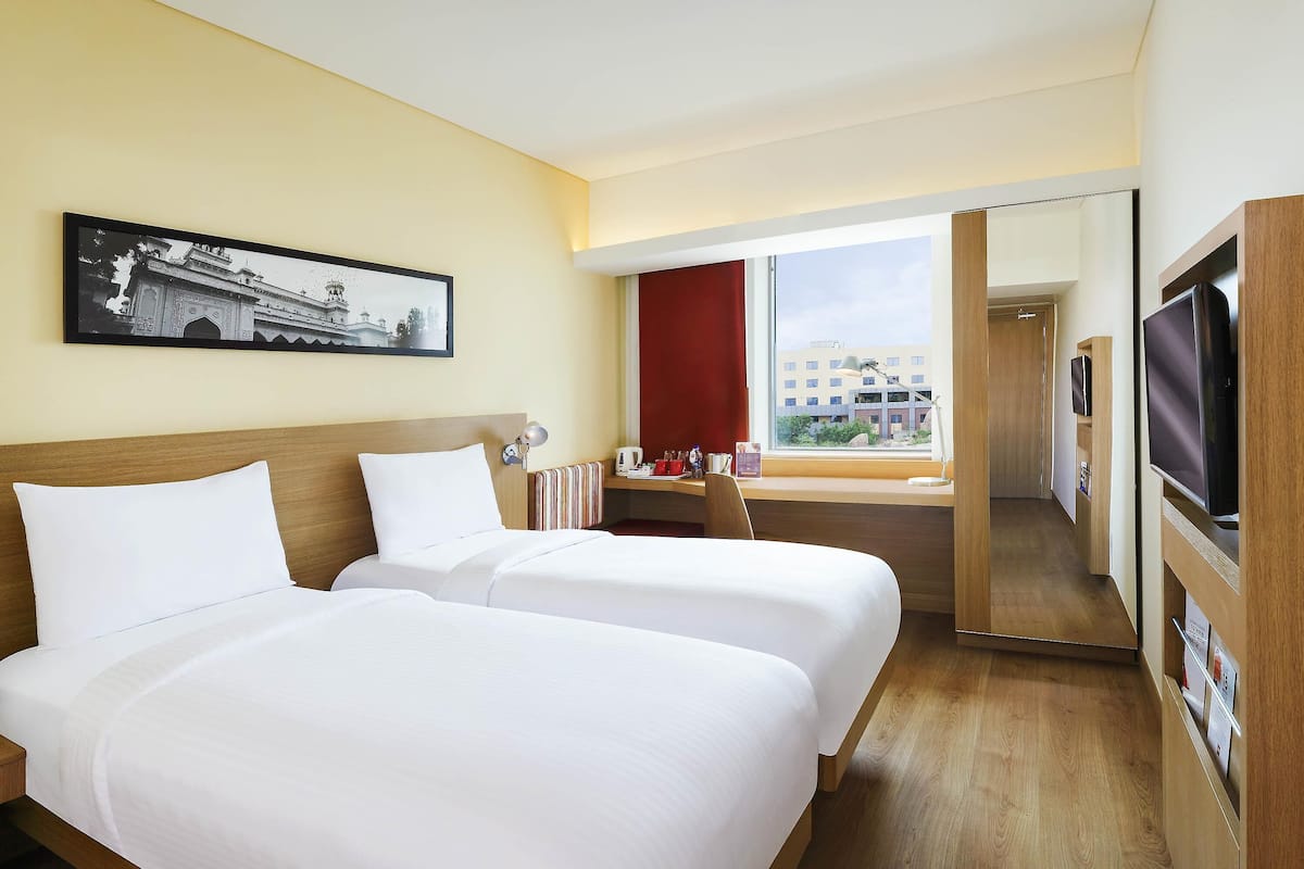 Premium bedding, memory-foam beds, minibar, in-room safe