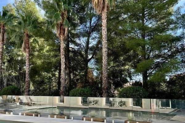 Seasonal outdoor pool, open 9:00 AM to 8:00 PM, pool umbrellas