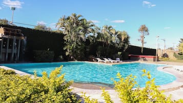 Outdoor pool, a waterfall pool, pool umbrellas