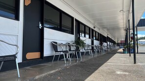 Enjoy al fresco dining in this outdoor seating area with comfortable chairs and tables.
