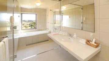 Combined shower/tub, free toiletries, hair dryer, slippers
