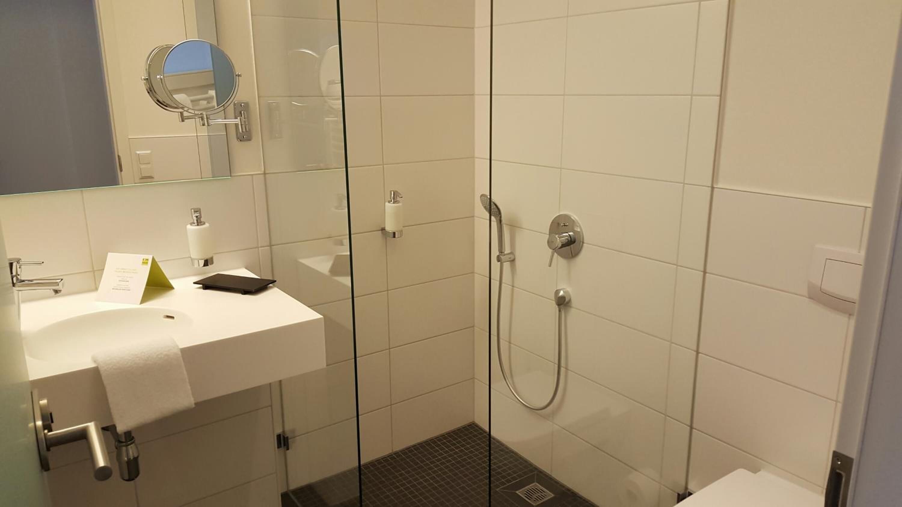 standard double or twin room | bathroom | shower, rainfall showerhead, hair dryer, towels