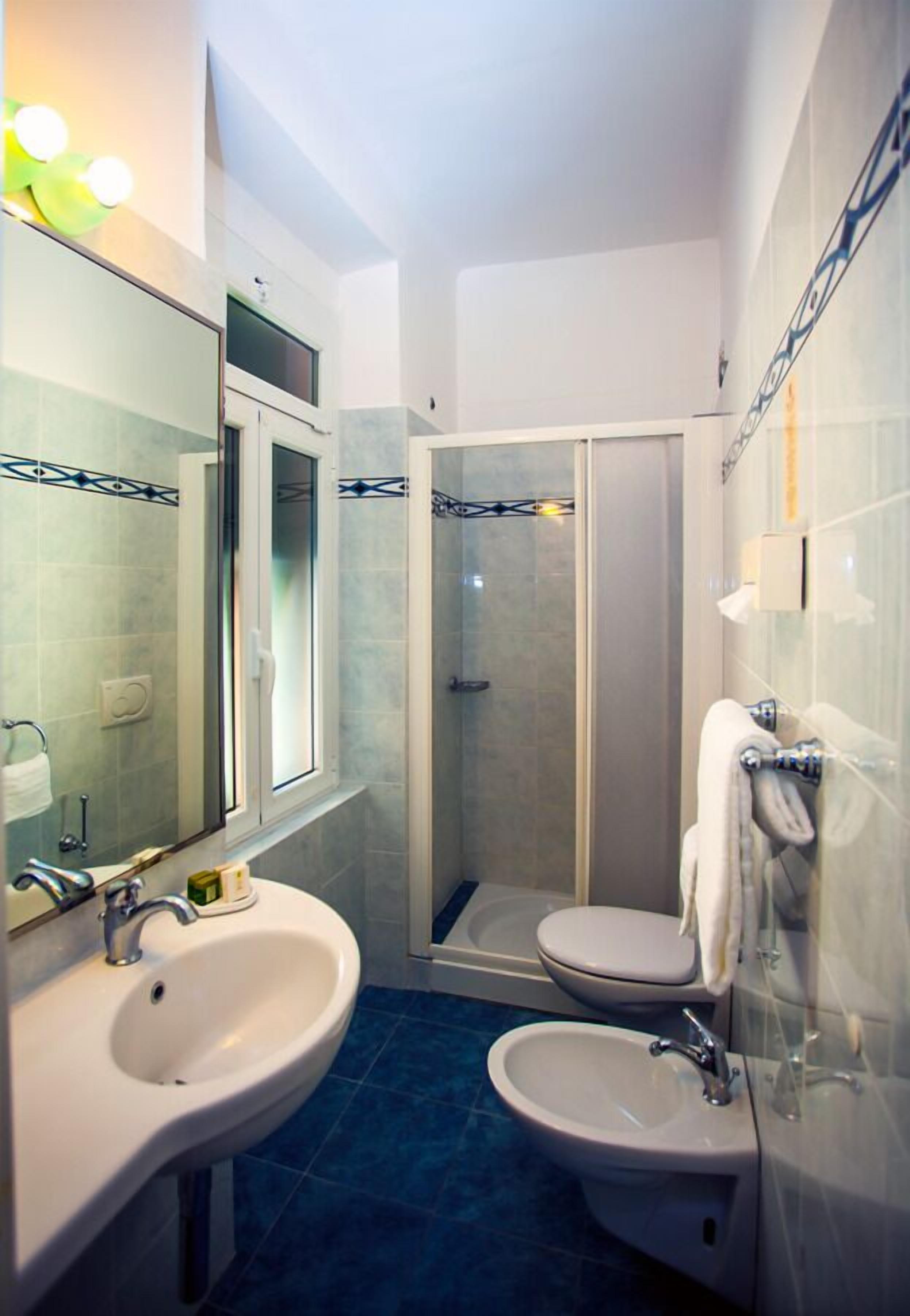 double or twin room | bathroom | shower, free toiletries, bidet, towels