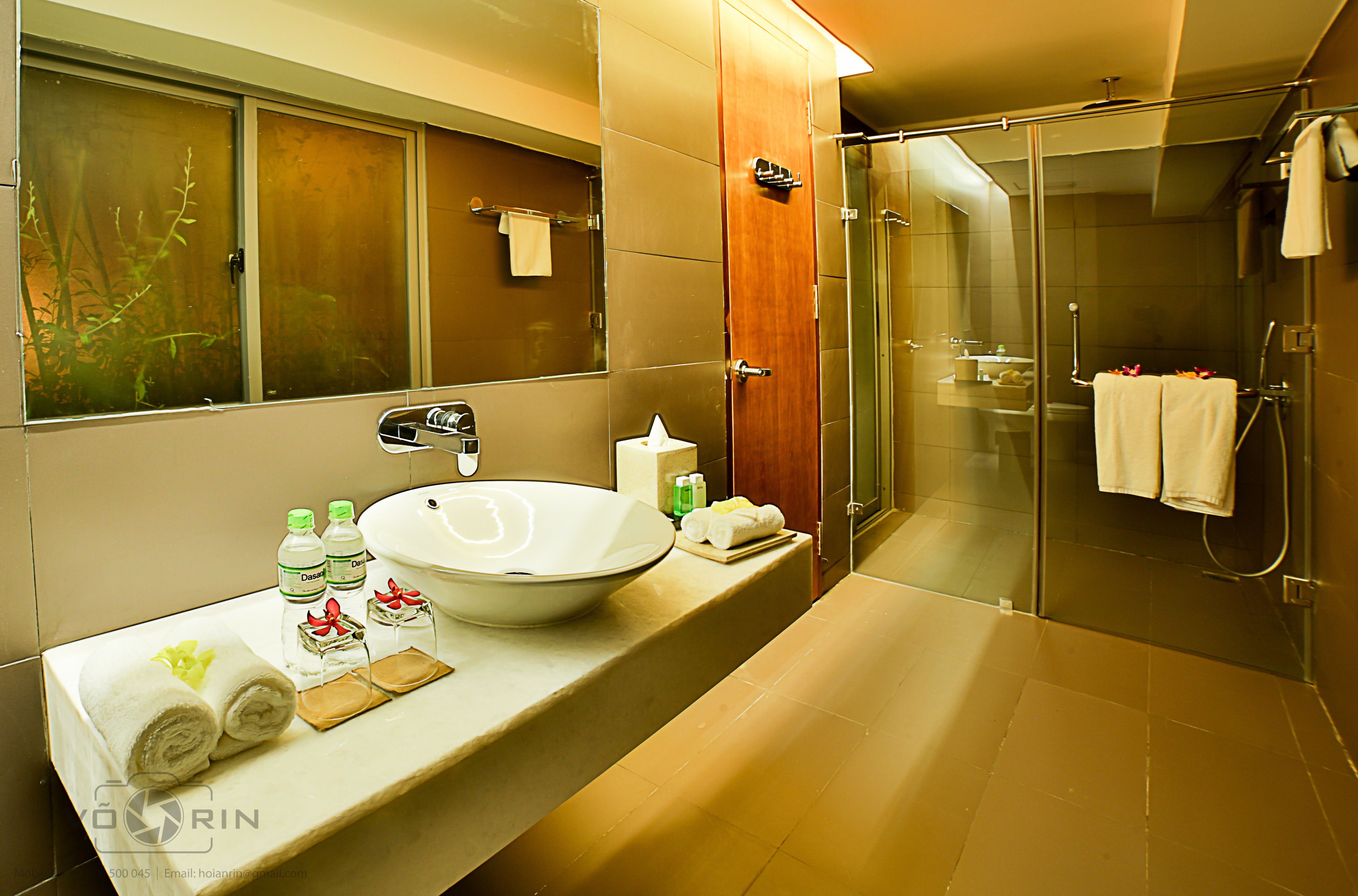 designer toiletries, hair dryer, bathrobes, slippers