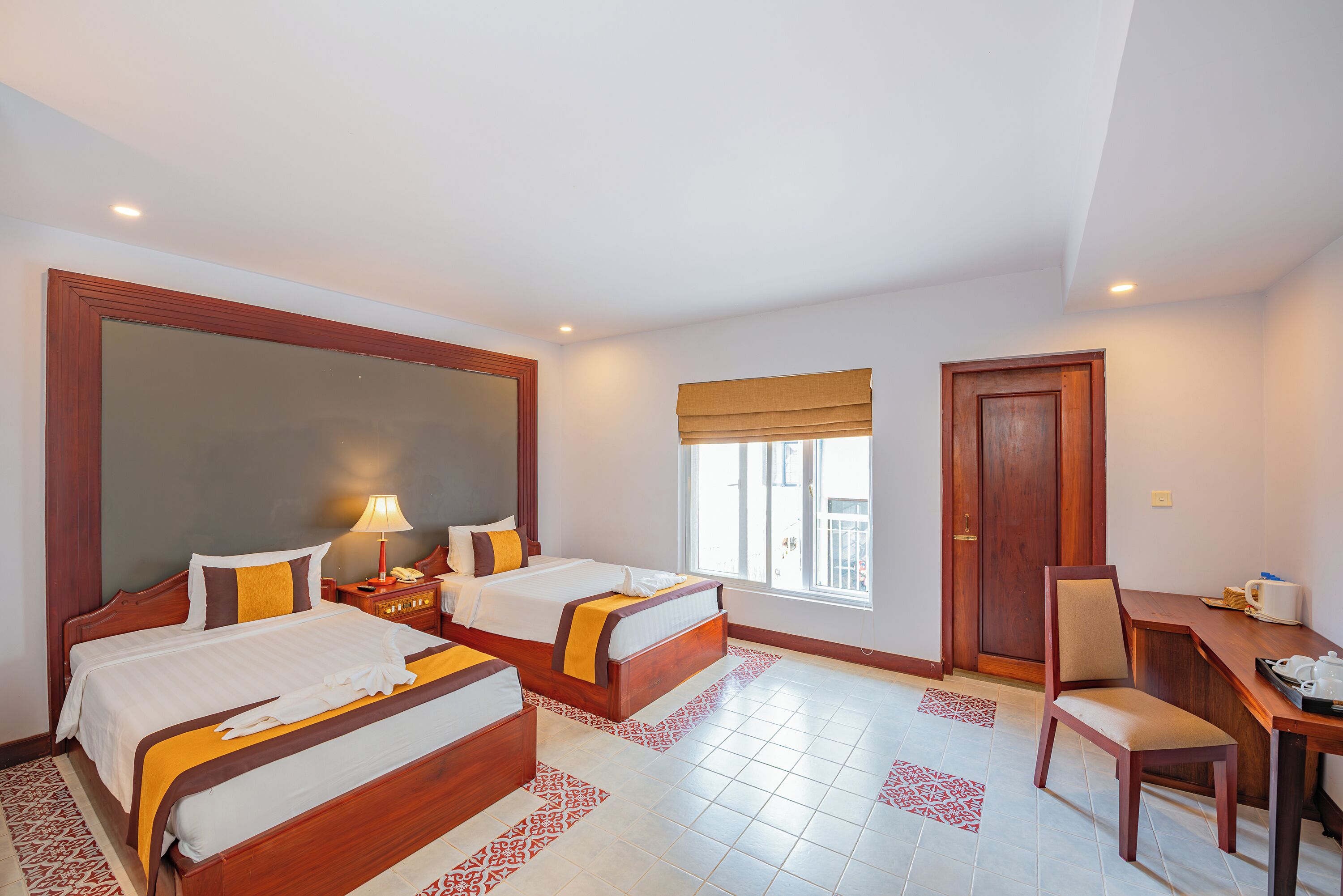 family room | 1 bedroom, minibar, in-room safe, desk