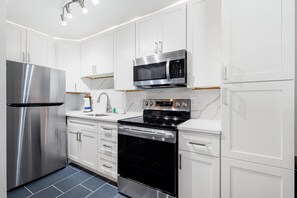 Condo, 1 King Bed with Sofa bed, Pool View (Gulf Holiday - Unit 10) | Private kitchen | Fridge, microwave, oven, stovetop