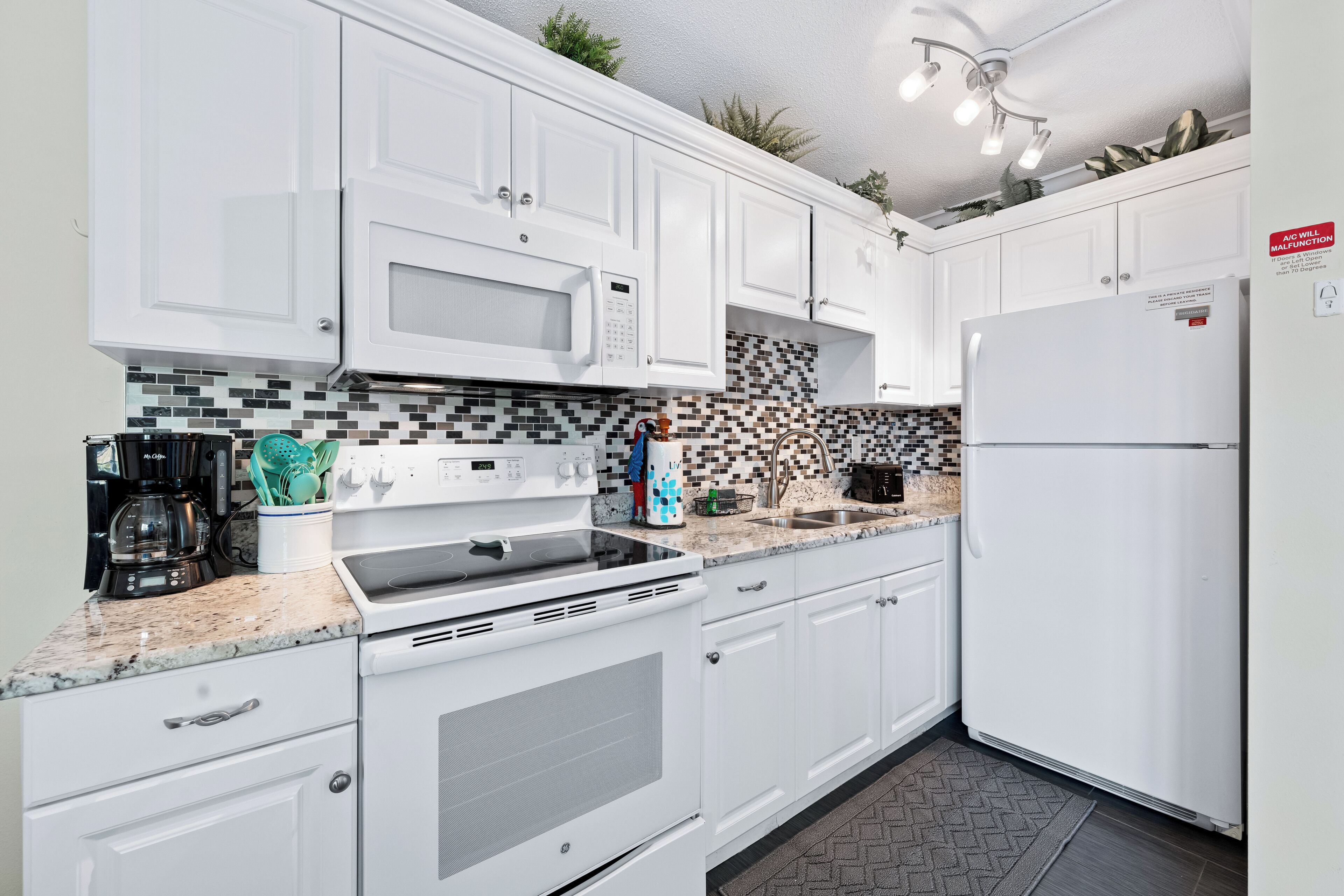 Condo (Gulf Holiday - Unit 09) | Private kitchen | Fridge, microwave, cookware/dishes/utensils, dining table