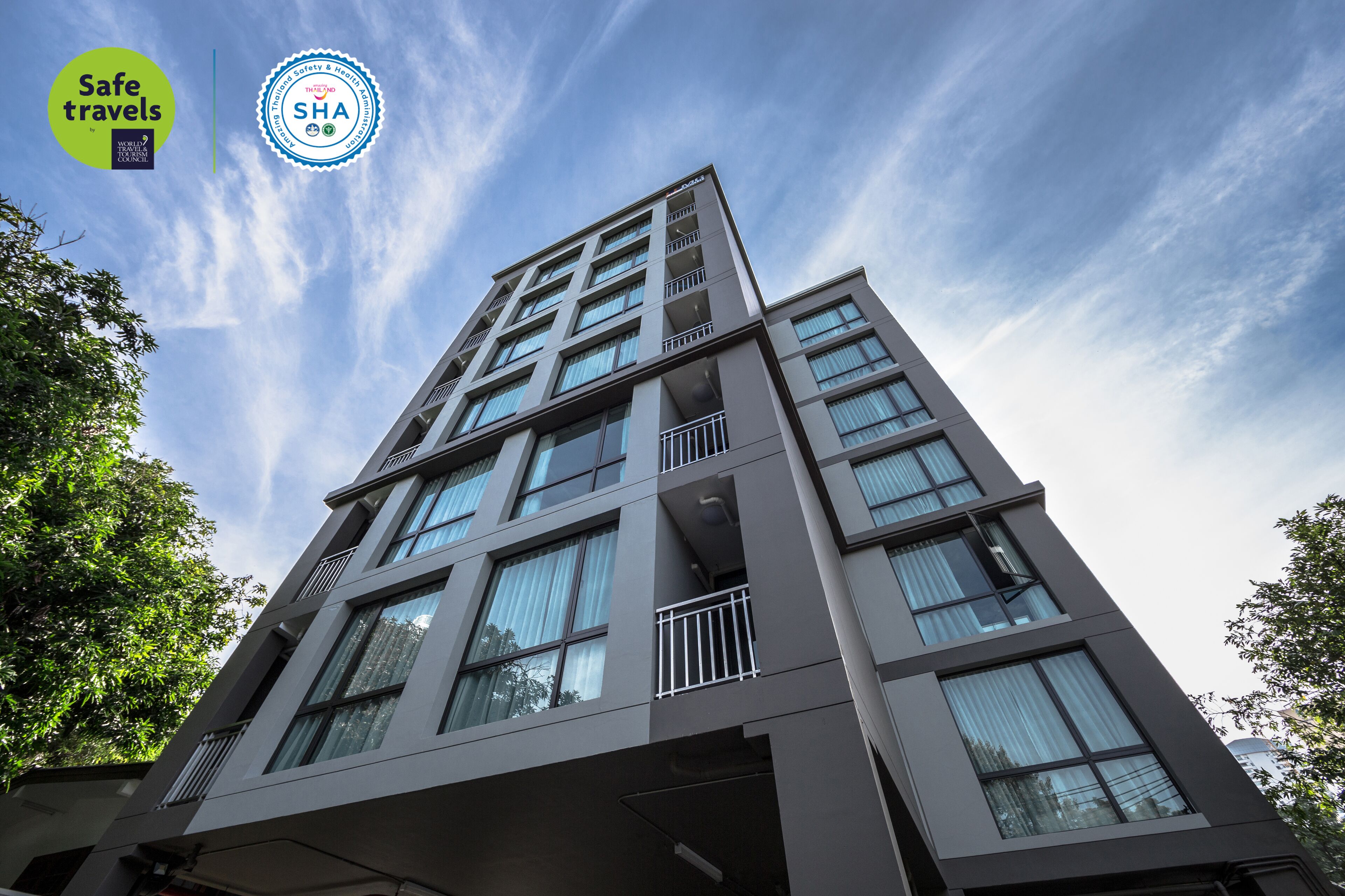 A modern multi-story building with a clear sky.