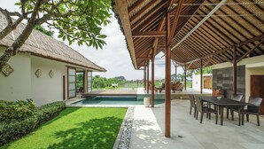 A covered outdoor area with a pool, seating, and a view of the landscape. - The Samata by LifestyleRetreats (Denpasar)