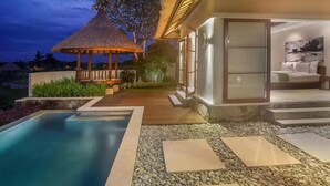 A modern villa with a pool, a thatched-roof gazebo, and a bedroom with a large window. - The Samata by LifestyleRetreats (Denpasar)