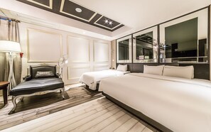 A hotel room with a large bed, a chair, a desk, and a mirror. - Hotel Arisu (Gimpo)