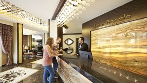 A reception desk with a marble countertop and a sign that reads "Hotel Piccolo." - Piccolo Dream Hotel - All Inclusive - Adults Only (Marmaris)