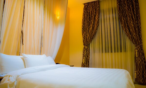 Premium bedding, desk, laptop workspace, free WiFi