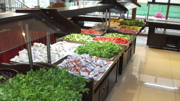 A buffet with various food options including salads, meats, and cheeses. - Golden Star Otel (Marmaris)