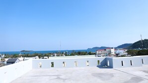A rooftop with a clear view of the sea and distant hills. - Lien Thong Hotel (Phu Quoc)