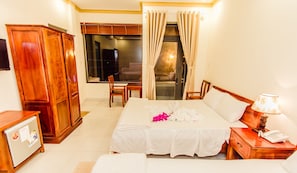 Family Quadruple Room, 1 Bedroom, Balcony, City View | Minibar, in-room safe, desk, blackout drapes - Lien Thong Hotel (Phu Quoc)